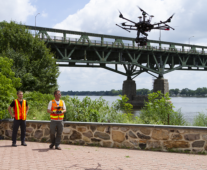 Men testing Phase One drone camera solutions for aerial bridge inspection