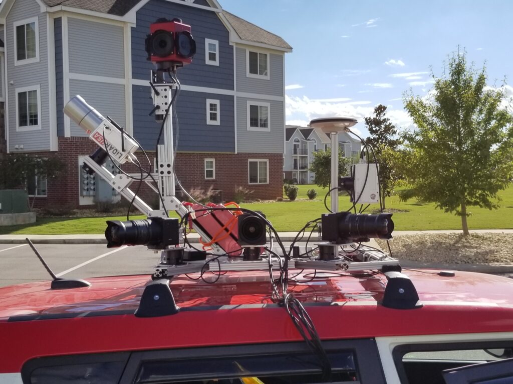 Car-based imaging solution employing mobile LiDAR technology to survey telephone poles for geospatial data collection.