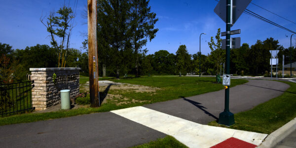 Detailed view of utility poles and wires, illustrating advanced geospatial data collection from roadside equipment