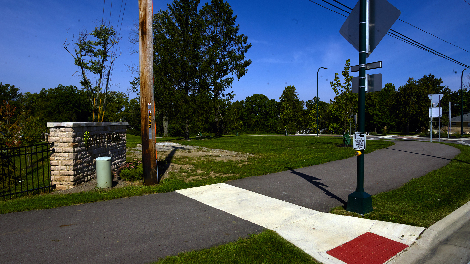 Detailed view of utility poles and wires, illustrating advanced geospatial data collection from roadside equipment