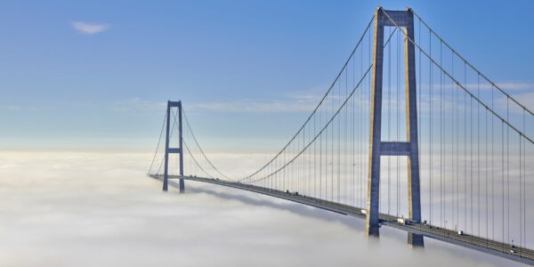 High quality aerial photography camera captures bridge in fog