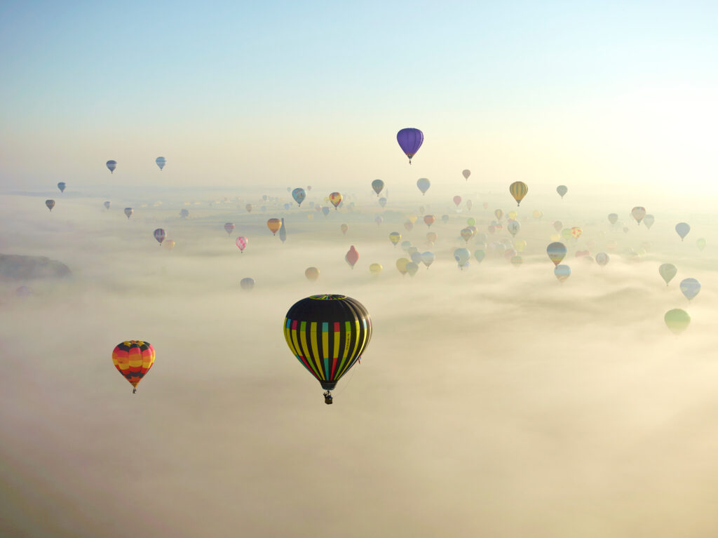 Eco-friendly aerial surveying with small planes and compact cameras